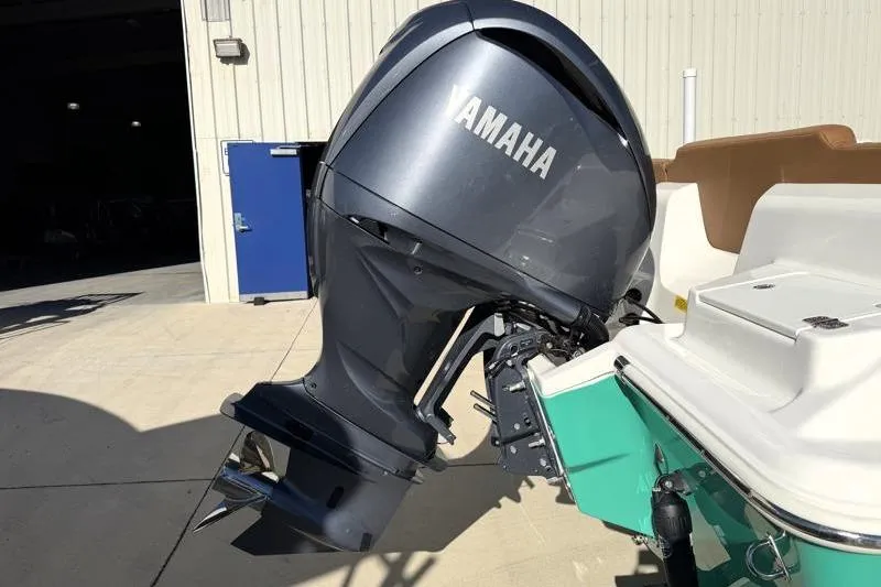 Slide: The Image of 2025 Key West 239 FS boat with Yamaha outboard motor in a sunny setting. - 15