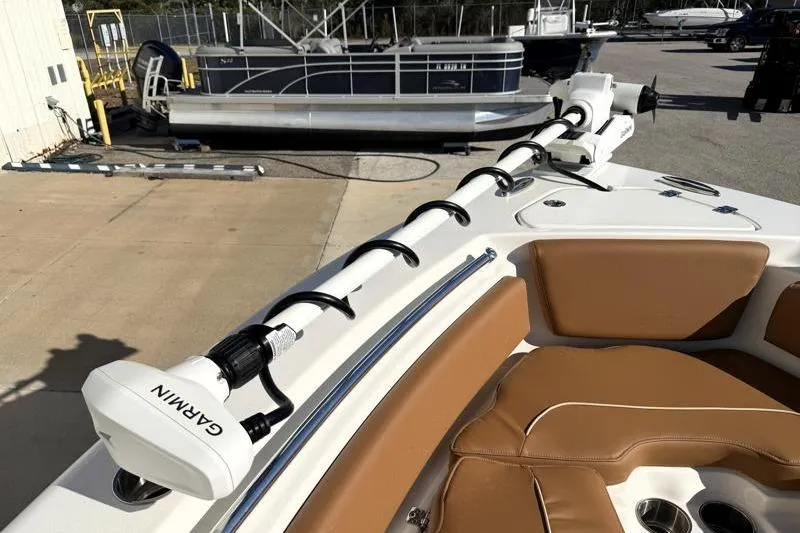 Slide: The Image of 2025 Key West 239 FS boat with Garmin equipment, featuring tan seating and sleek design. - 19