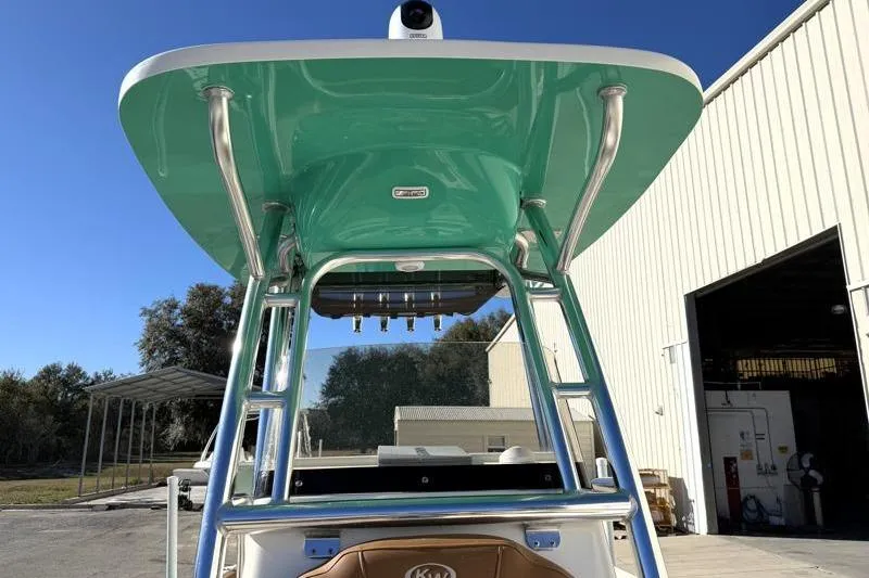 Slide: The Image of 2025 Key West 239 FS boat with teal T-top and stainless steel frame. - 24