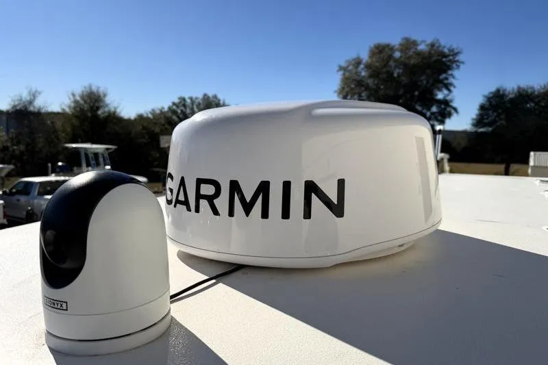 Slide: The Image of Garmin radar on 2025 Key West 239 FS boat under clear blue sky. - 25