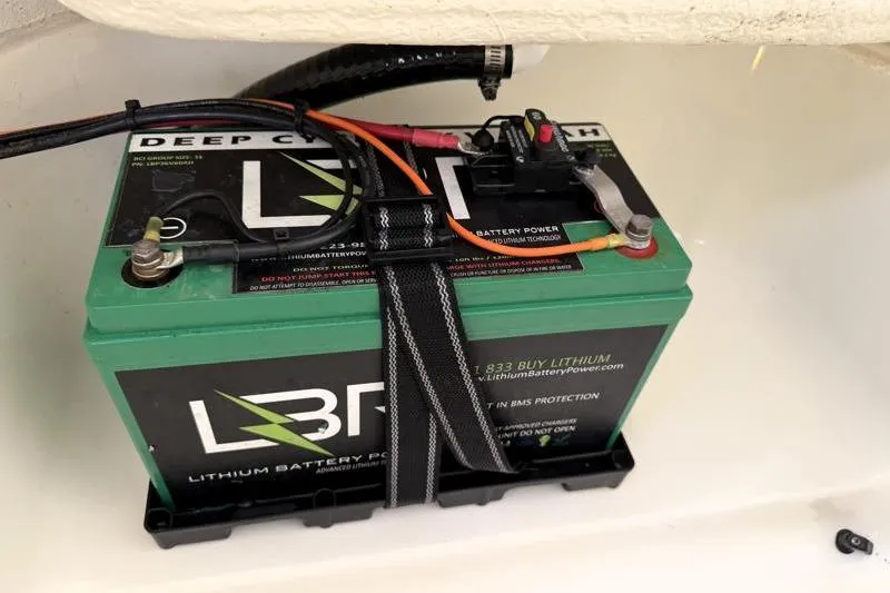 Slide: The Image of Lithium battery in Key West 239 FS boat, 2025 model, secured with strap. - 31