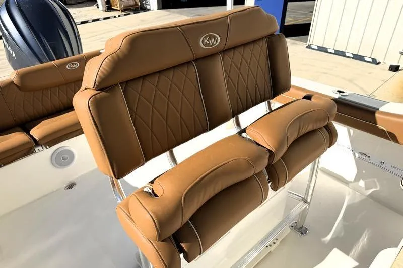 Slide: The Image of 2025 Key West 239 FS boat with tan leather seating and stainless steel frame. - 33