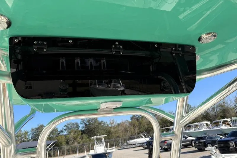 Slide: The Image of 2025 Key West 239 FS boat with green T-top and stainless steel frame. - 37