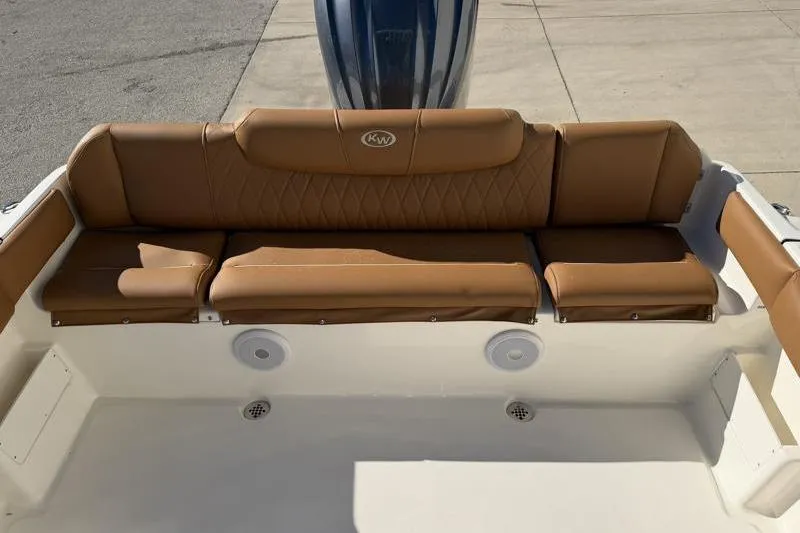Slide: The Image of 2025 Key West 239 FS boat with tan leather seating and sleek design. - 40