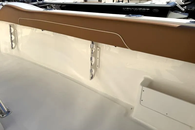 Slide: The Image of 2025 Key West 239 FS boat interior with tan accents and sleek design. - 43