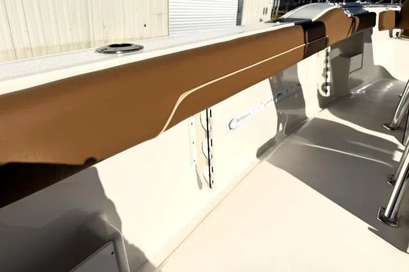 Slide: The Image of 2025 Key West 239 FS boat interior with brown trim and sleek design. - 44