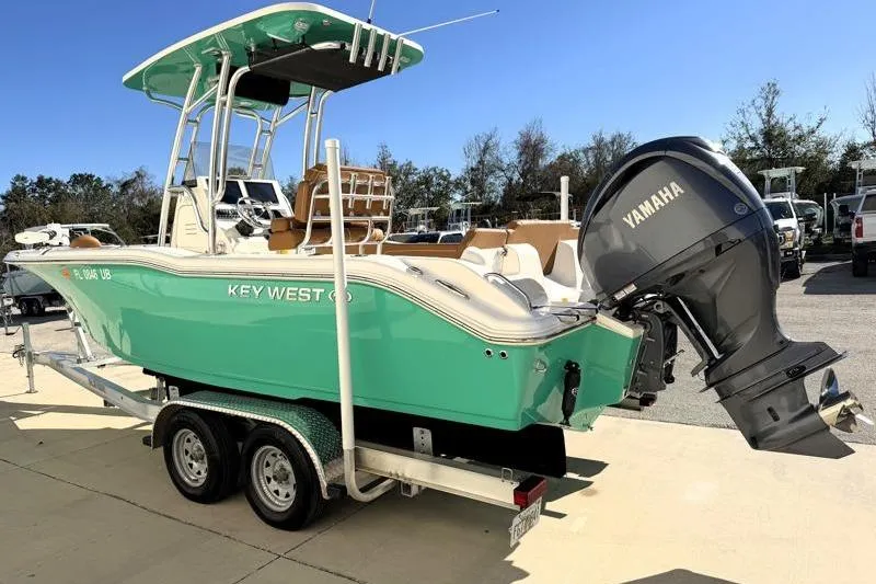 Slide: The Image of 2025 Key West 239 FS boat with Yamaha engine on trailer, vibrant green hull. - 5