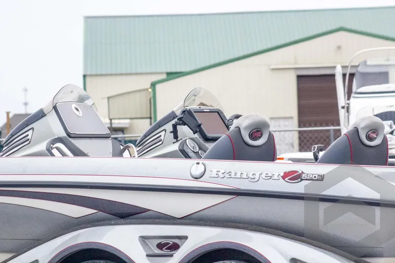 Slide: The Image of 2014 Ranger Z520 Comanche boat with dual consoles and advanced electronics. - 11