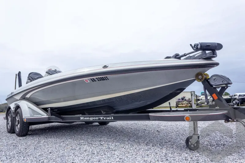 Slide: The Image of 2014 Ranger Z520 Comanche boat on trailer, parked on gravel. - 15