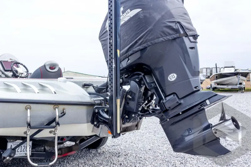 Slide: The Image of 2014 Ranger Z520 Comanche boat with powerful outboard motor on gravel lot. - 23