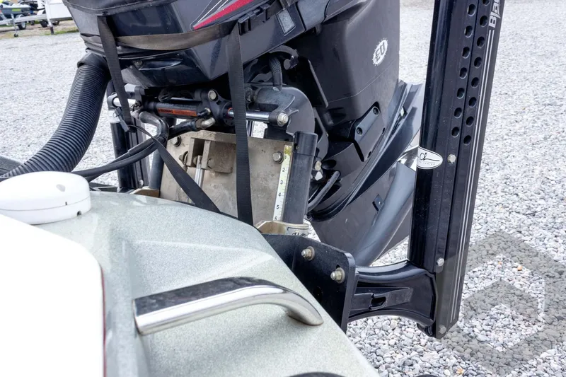 Slide: The Image of 2014 Ranger Z520 Comanche boat engine detail on gravel surface. - 24