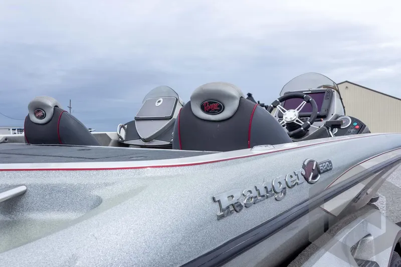 Slide: The Image of 2014 Ranger Z520 Comanche boat interior with steering wheel and seats. - 25