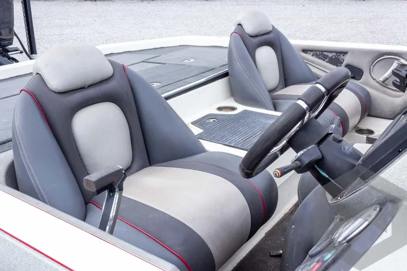 Slide: The Image of 2014 Ranger Z520 Comanche boat interior with dual seats and steering wheel. - 26