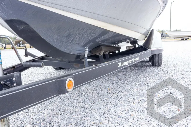 Slide: The Image of 2014 Ranger Z520 Comanche boat on Ranger Trail trailer, parked on gravel. - 31