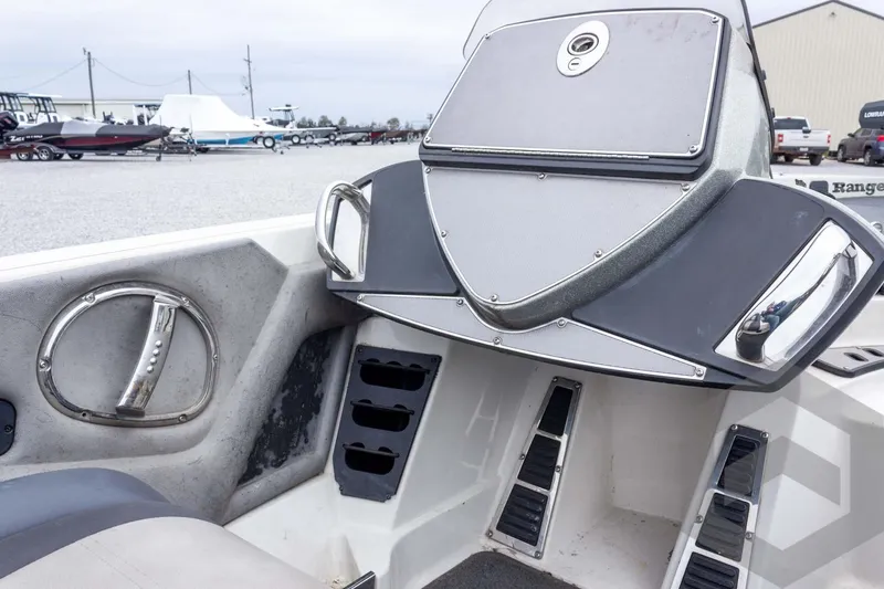 Slide: The Image of 2014 Ranger Z520 Comanche boat interior with sleek dashboard and chrome accents. - 50