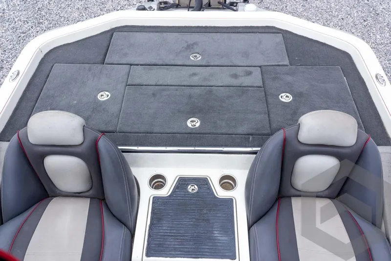 Slide: The Image of 2014 Ranger Z520 Comanche boat interior with dual seats and storage compartments. - 51