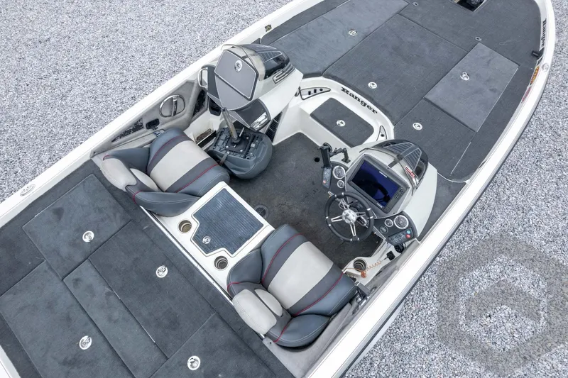 Slide: The Image of 2014 Ranger Z520 Comanche boat interior with dual seats and control console. - 60