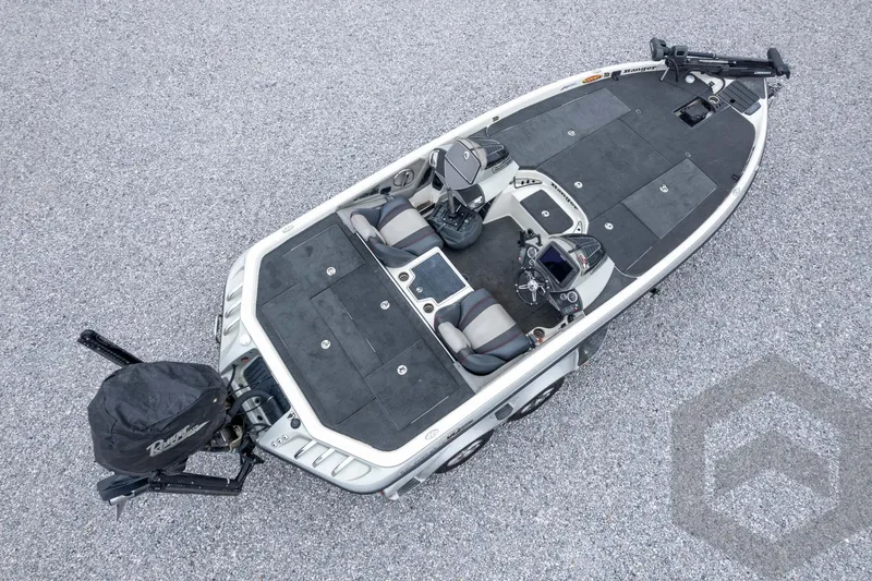 Slide: The Image of 2014 Ranger Z520 Comanche fishing boat, aerial view, featuring dual seats and advanced controls. - 63