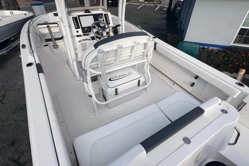 Slide: The Image of 2023 Robalo R222 Explorer boat interior with helm, seating, and console. - 13