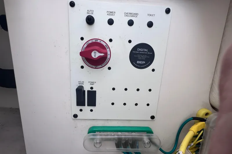Slide: The Image of Control panel of 2023 Robalo R222 Explorer boat with switches and digital relay. - 18