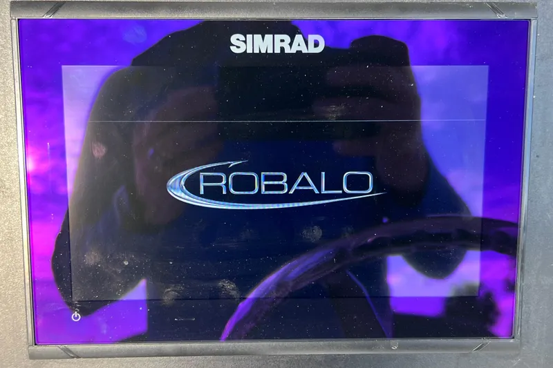 Slide: The Image of Simrad display showing Robalo logo on 2023 Robalo R222 Explorer boat. - 27