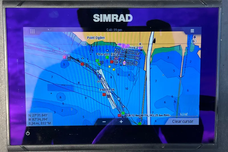 Slide: The Image of Simrad navigation display on 2023 Robalo R222 Explorer boat, showing marine chart. - 35