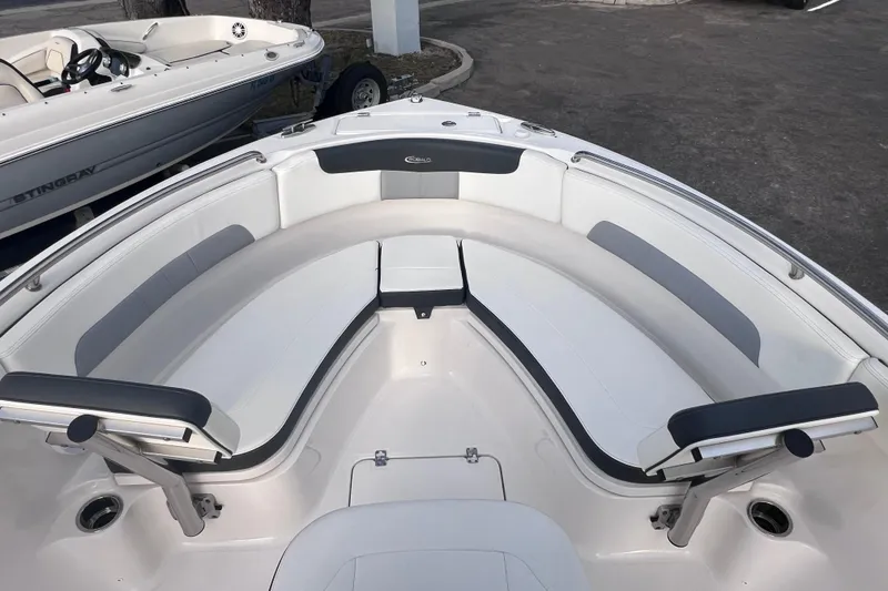 Slide: The Image of 2023 Robalo R222 Explorer boat interior with white and gray seating. - 37