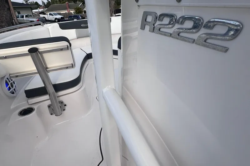 Slide: The Image of 2023 Robalo R222 Explorer boat interior with seating and branding detail. - 39