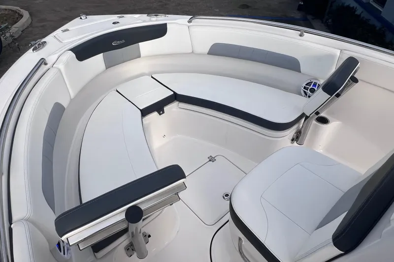 Slide: The Image of 2023 Robalo R222 Explorer boat interior with white and gray seating. - 40