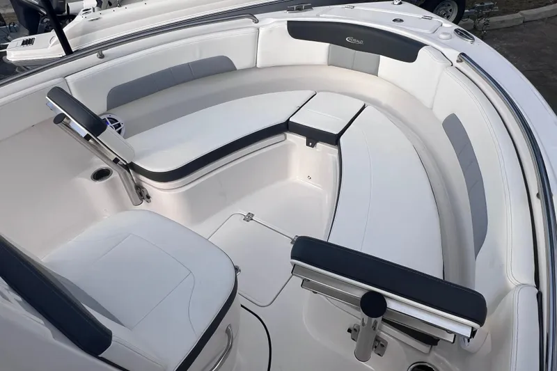 Slide: The Image of 2023 Robalo R222 Explorer boat interior with white and gray seating arrangement. - 41