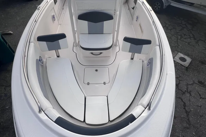 Slide: The Image of 2023 Robalo R222 Explorer boat interior with white seating and modern design. - 42