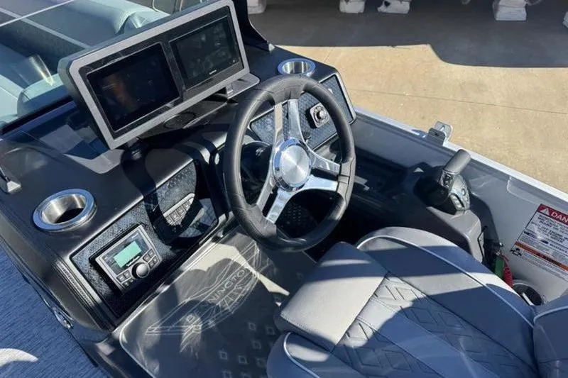 Slide: The Image of 2025 Bennington 26 MSB-ESP boat dashboard with steering wheel and dual displays. - 17