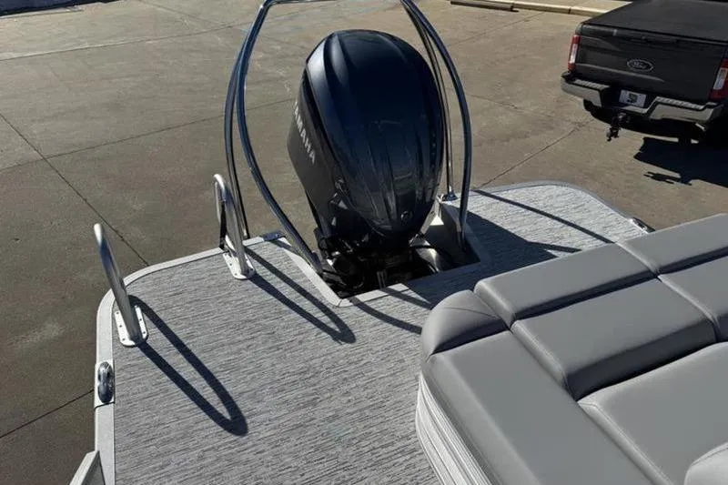 Slide: The Image of 2025 Bennington 26 MSB-ESP boat with Yamaha outboard motor and gray seating. - 22