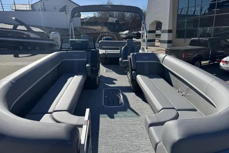 Slide: The Image of 2025 Bennington 26 MSB-ESP pontoon boat with spacious seating and modern design. - 24