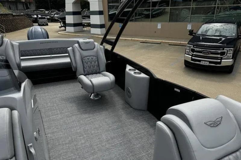 Slide: The Image of 2025 Bennington 26 LXSSBA pontoon boat interior with luxurious seating and modern design. - 12