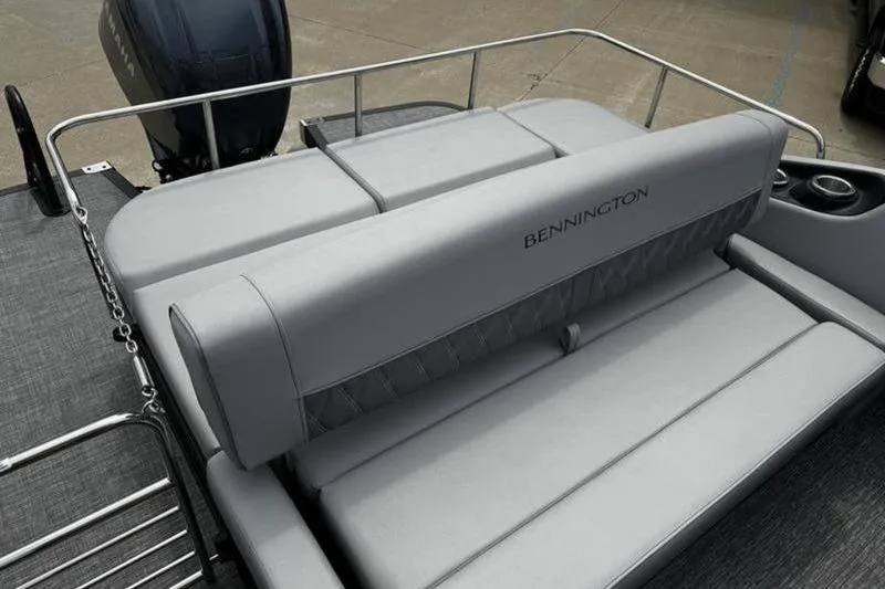 Slide: The Image of 2025 Bennington 26 LXSSBA boat with gray seating and sleek design. - 13