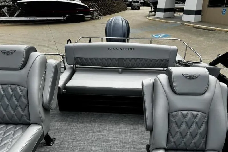 Slide: The Image of 2025 Bennington 26 LXSSBA boat interior with luxurious gray seating. - 15