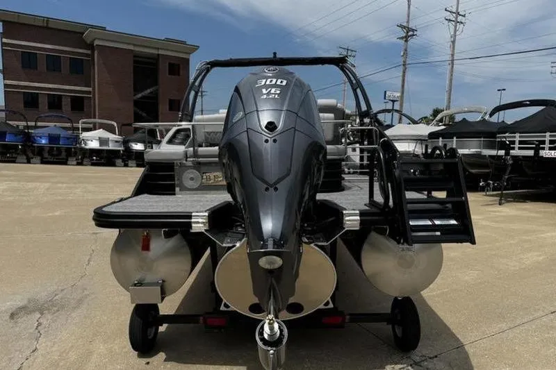 Slide: The Image of 2025 Bennington 26 LXSSBA pontoon boat with powerful 300 V6 engine, displayed outdoors. - 8