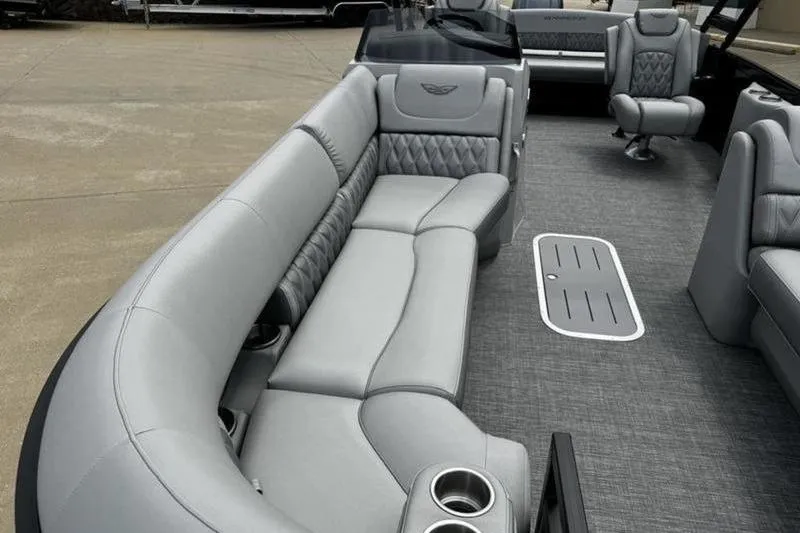 Slide: The Image of Luxurious interior of 2025 Bennington 26 LXSSBA pontoon boat with plush seating and cup holders. - 9
