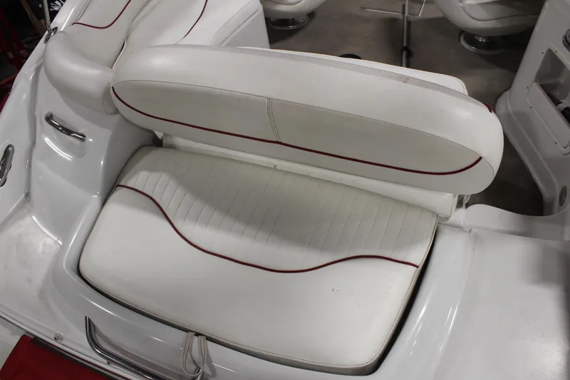 Slide: The Image of White seating area on a 2008 Crownline 220 EX boat with red accents. - 10