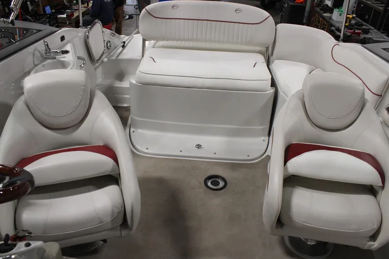 Slide: The Image of 2008 Crownline 220 EX boat interior with white and red seating arrangement. - 13