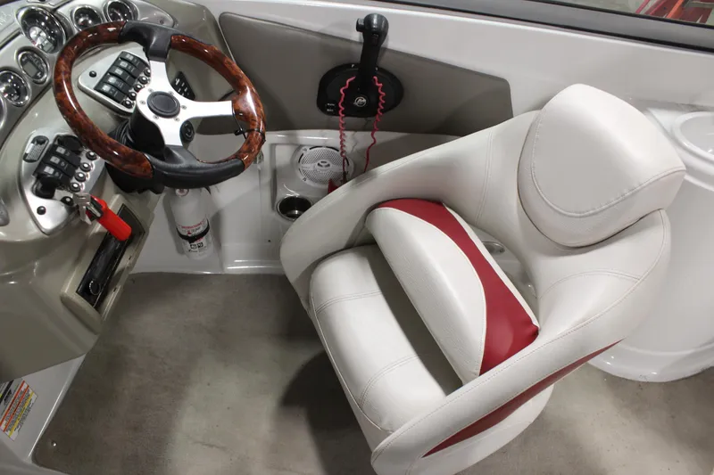 Slide: The Image of 2008 Crownline 220 EX boat interior with steering wheel and captain's seat. - 17