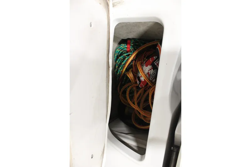 Slide: The Image of Storage compartment in 2008 Crownline 220 EX boat with ropes and equipment. - 18