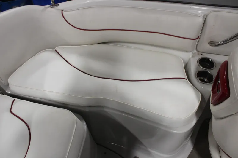 Slide: The Image of 2008 Crownline 220 EX boat interior with white seating and red accents. - 19