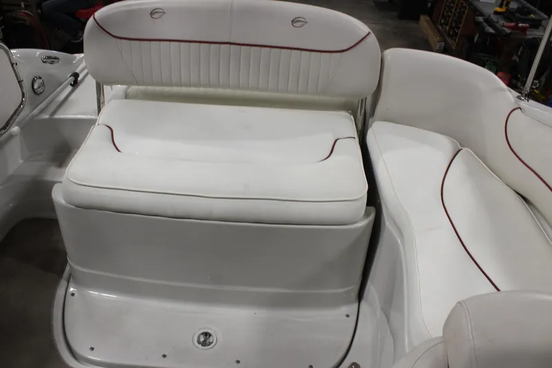 Slide: The Image of 2008 Crownline 220 EX boat interior with white cushioned seating. - 20