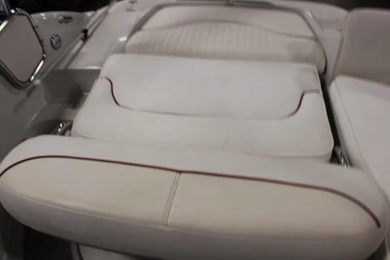 Slide: The Image of 2008 Crownline 220 EX boat interior with white cushioned seating. - 22