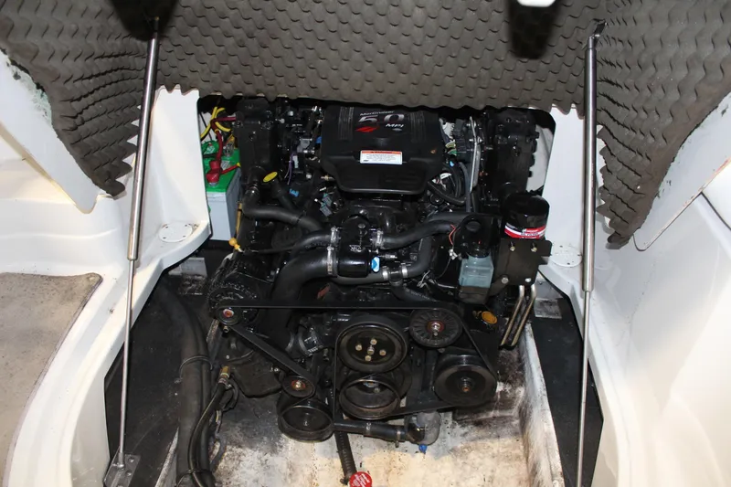 Slide: The Image of Engine compartment of a 2008 Crownline 220 EX boat, showcasing mechanical components. - 23