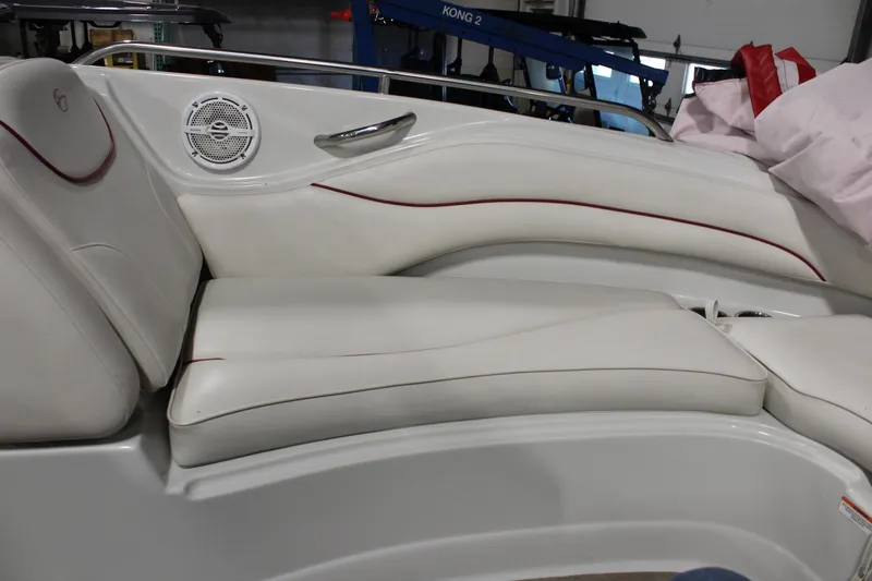 Slide: The Image of 2008 Crownline 220 EX boat interior with white cushioned seating and speaker. - 28