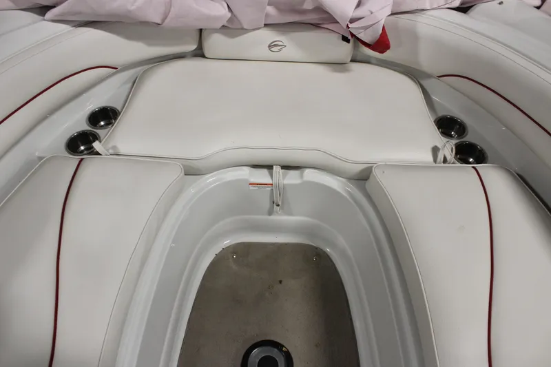 Slide: The Image of 2008 Crownline 220 EX boat interior with white seating and cup holders. - 30