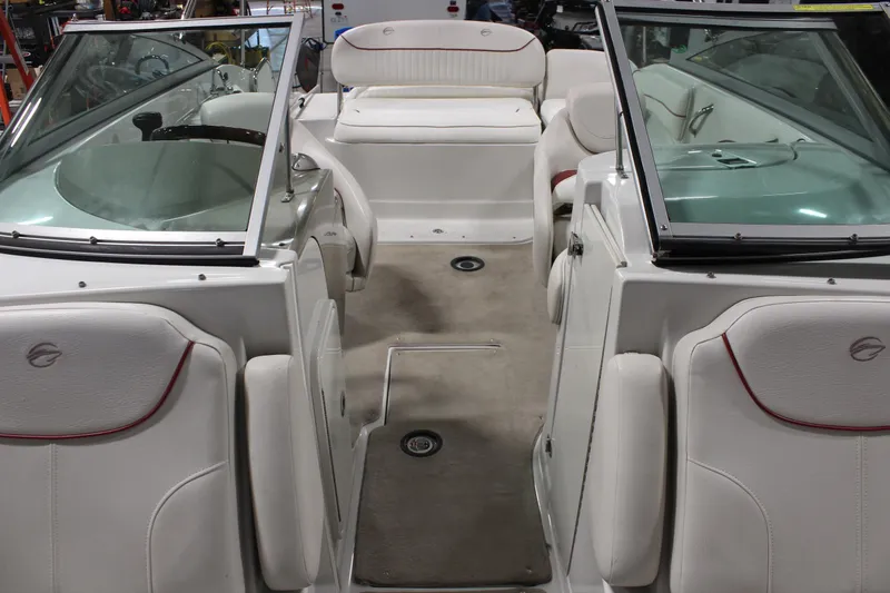 Slide: The Image of Interior of a 2008 Crownline 220 EX boat with white seating and windshield. - 35